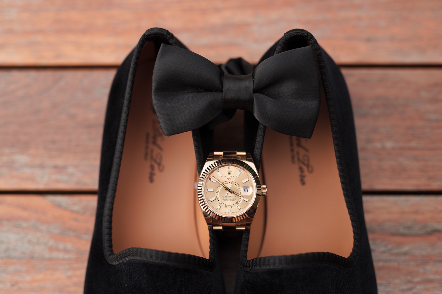 A rolex and a bowtie from a Mr. C Seaport Hotel on a wedding day at Cipriani Wall Street in New York City. 