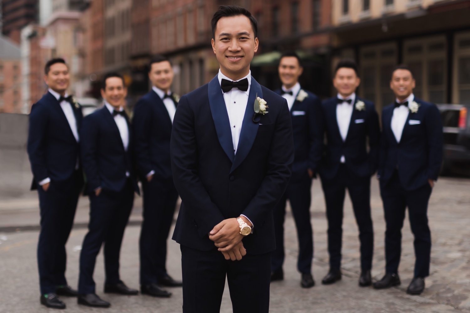 A portrait of a groom and his groomsmen near Mr. C Seaport on a wedding day at Cipriani Wall Street in New York City. 