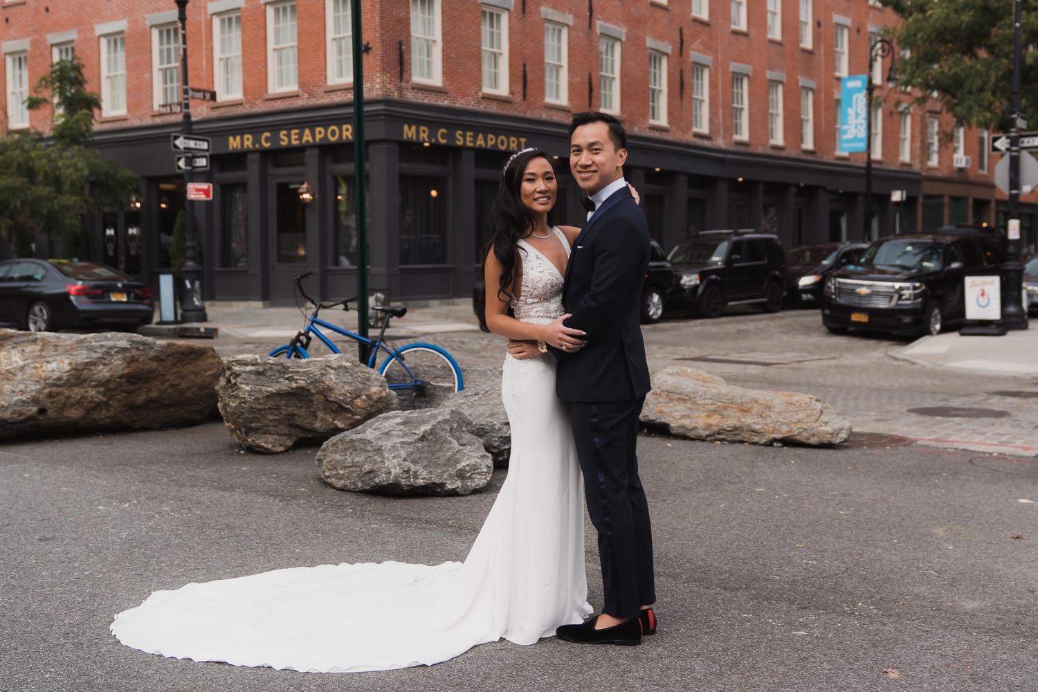 A first look session of a bride and a groom near Mr. C Seaport Hotel on a wedding day at Cipriani Wall Street. Wedding Dress by Pronovias