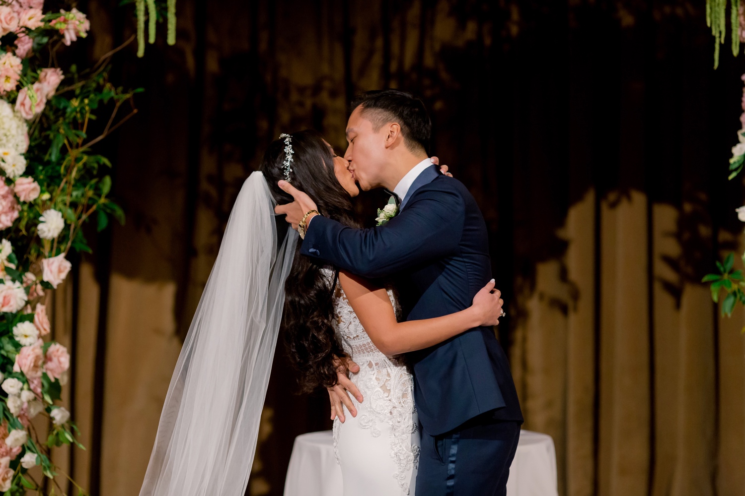 A first kiss as a husband and wife during a wedding ceremony at Cipriani Wall Street in New York City. 