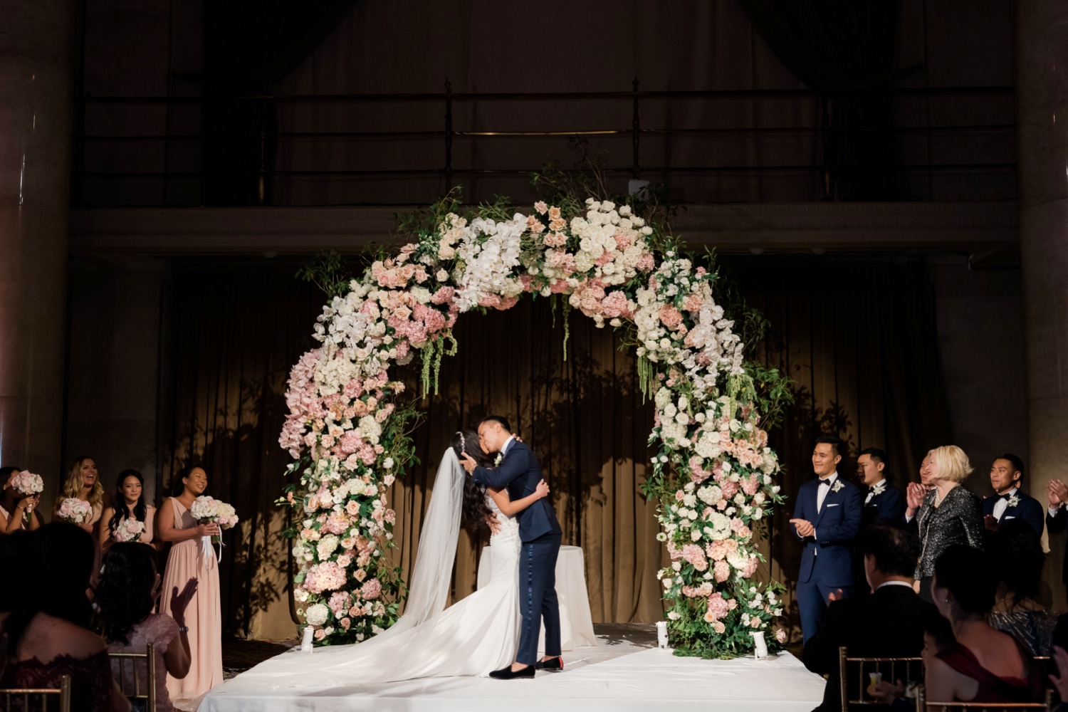 A first kiss as a husband and wife during a wedding ceremony at Cipriani Wall Street in New York City. 