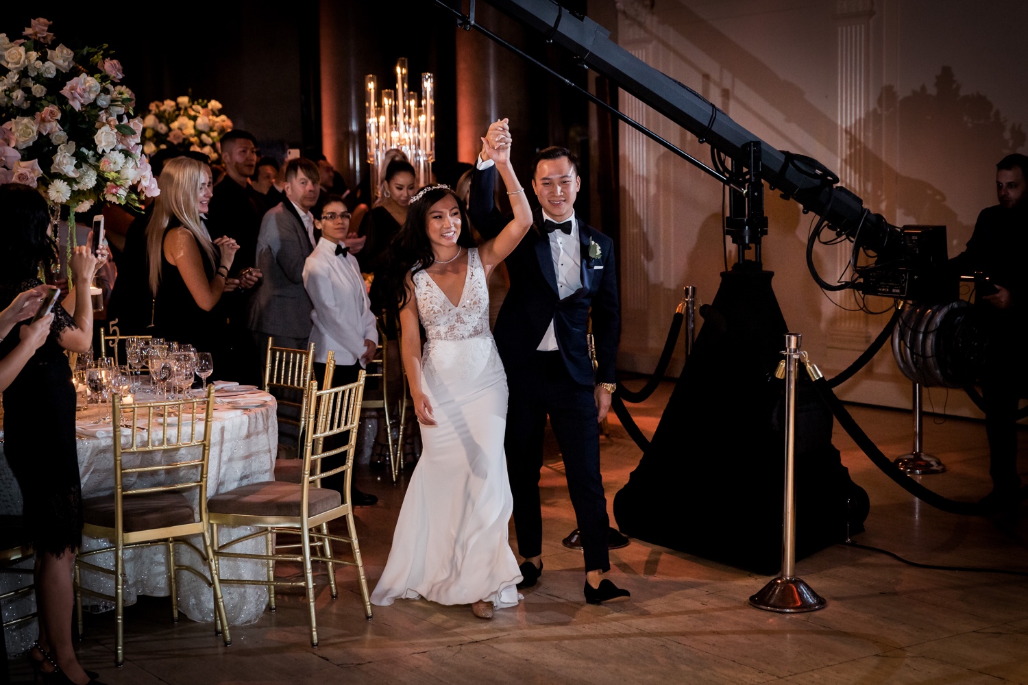 A newly wedded couple entering their wedding reception at Cipriani Wall Street in New York City.