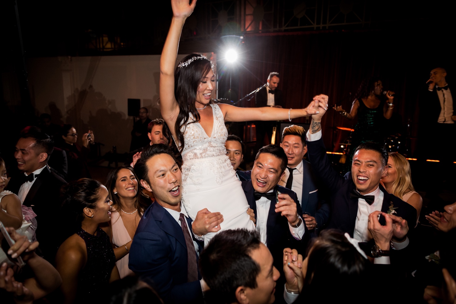 Wedding guests celebrating a newly wedded wife for her marriage at Cipriani Wall Street in New York City. Music by Hank Lane Band