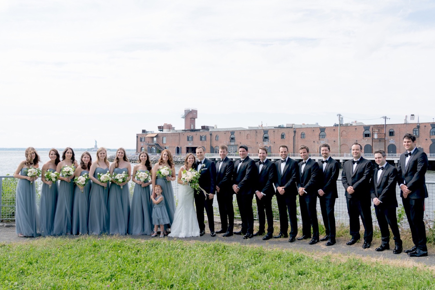A portrait session of a bride, a groom, and their wedding parties near Liberty Warehouse, Brooklyn New York.