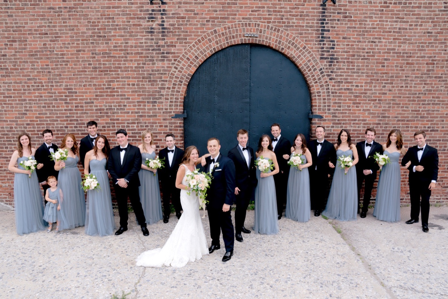A portrait session of a bride, a groom, and their wedding parties near Liberty Warehouse, Brooklyn New York. 