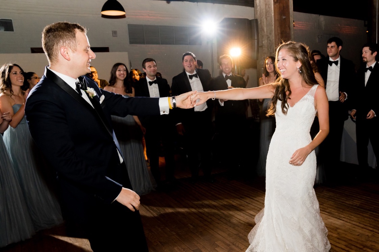 A newly wedded couple's first dance during a wedding reception at Liberty Warehouse, Brooklyn New York. 