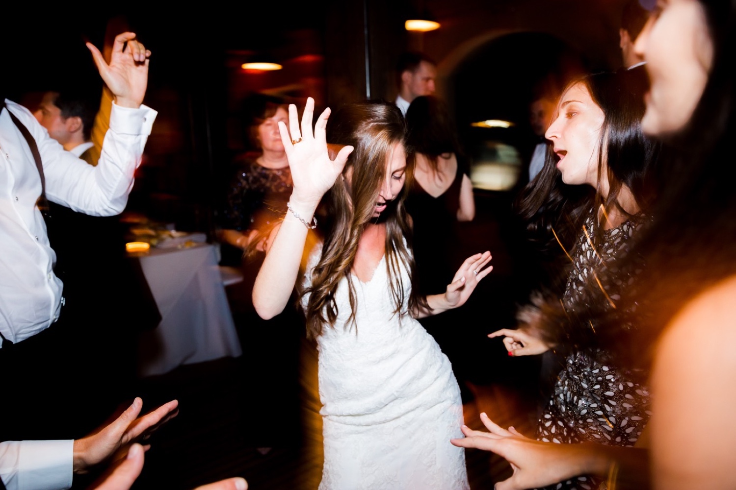 A newly wedded bride dancing together during a wedding reception at Liberty Warehouse, Brooklyn New York.