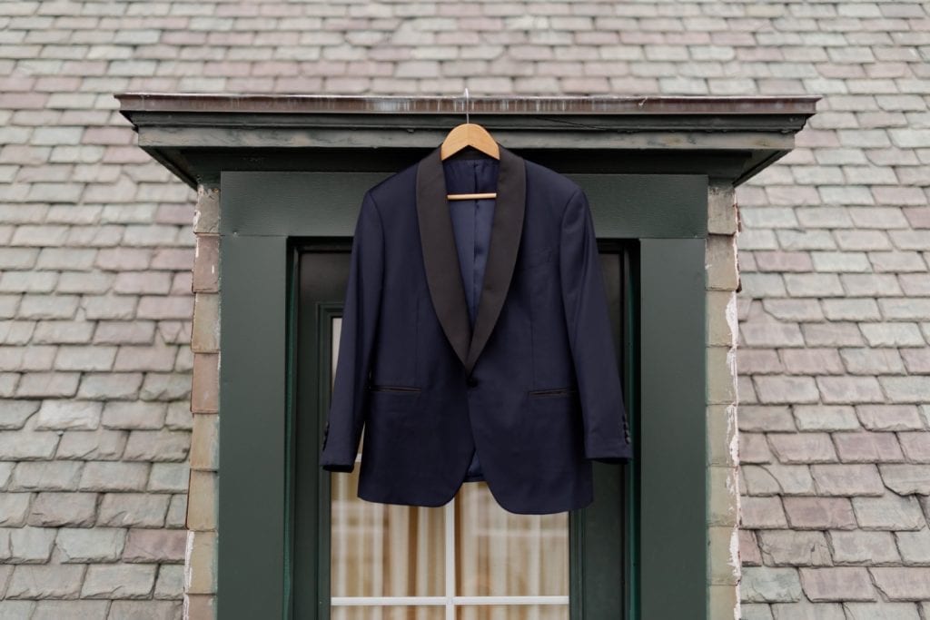A wedding suit hanging outside.
