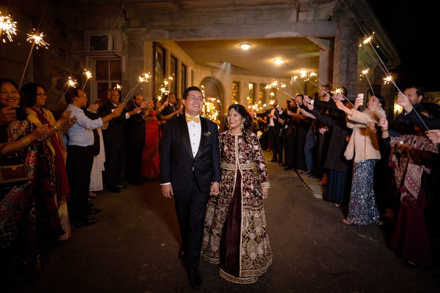 A newly wedded couple exiting their wedding venue end of the night at the Tappan Hill Mansion. 