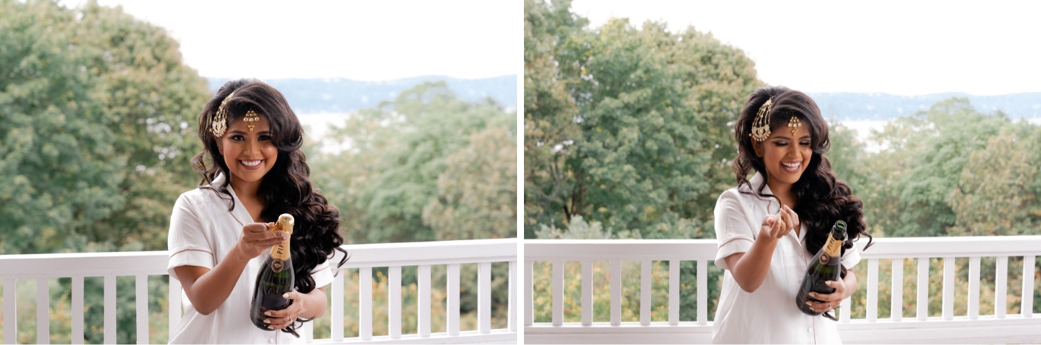 A bride opening a champagne bottle.