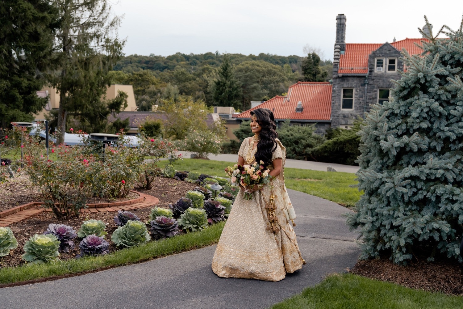 A bride walking towards her bride during a first look on a wedding day at the Tappan Hill Mansion. 