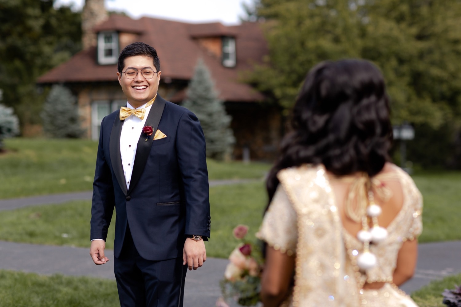 A groom seeing his bride for the first time during a first look on a wedding day at the Tappan Hill Mansion. 