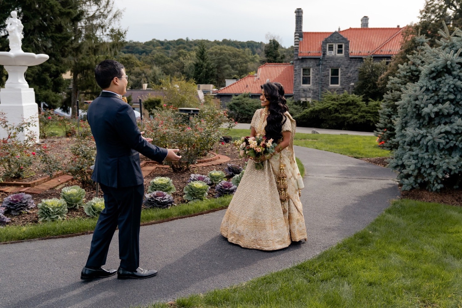 A groom seeing his bride for the first time during a first look on a wedding day at the Tappan Hill Mansion. 