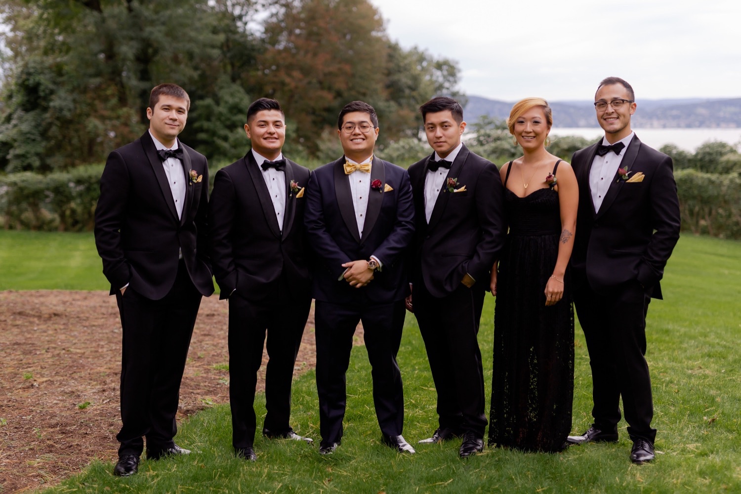A groom and his groomsmen posing for a picture at the Tappan Hill Mansion.