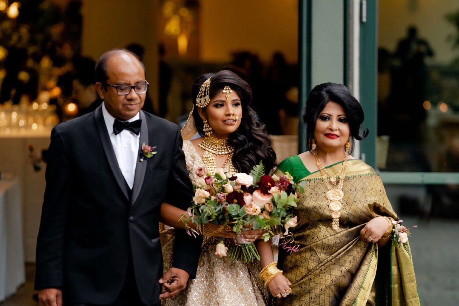 A bride and her parent coming to the wedding ceremony at the Tappan Hill Mansion.