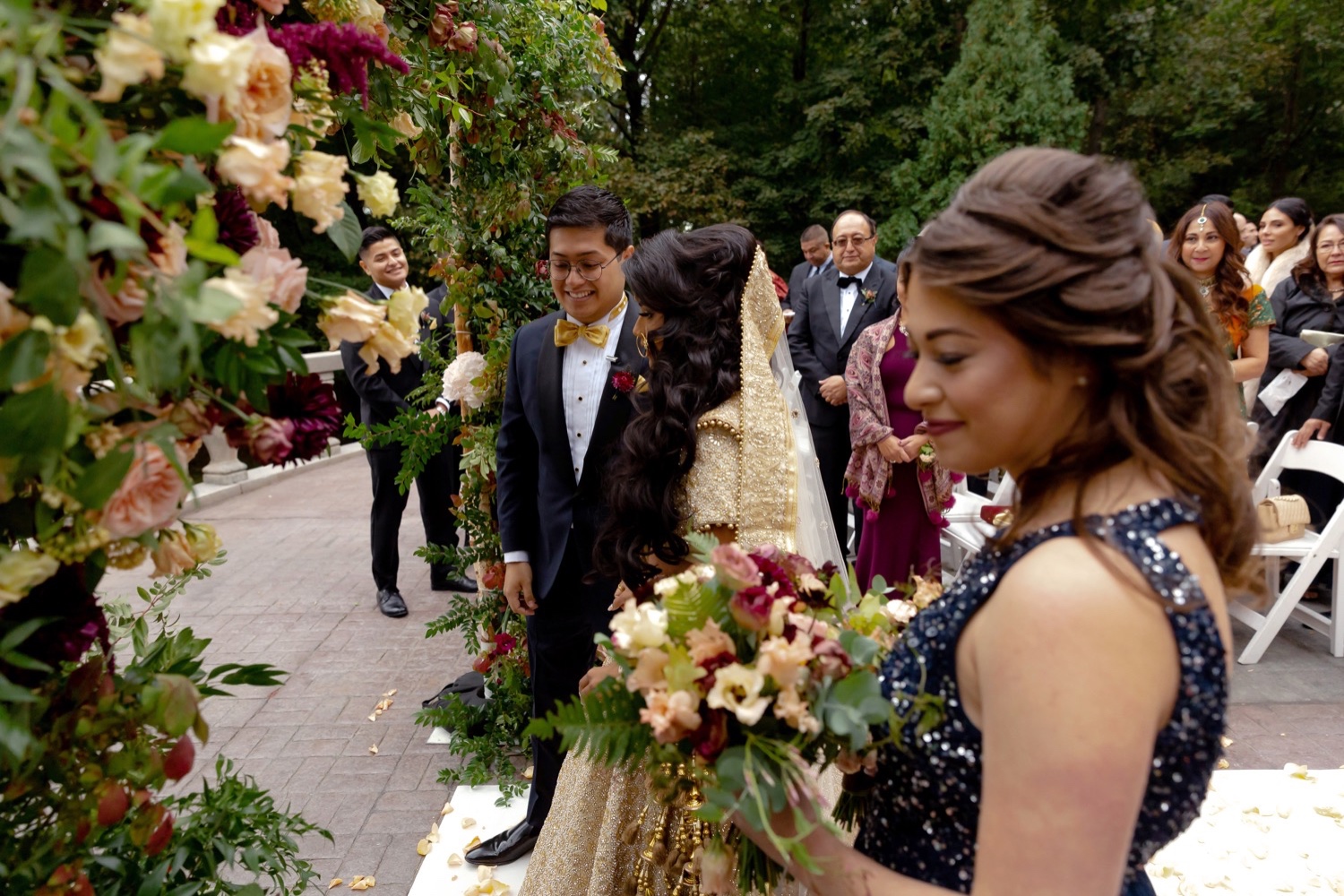 A groom escorting her bride during wedding ceremony starts at the Tappan Hill Mansion. 