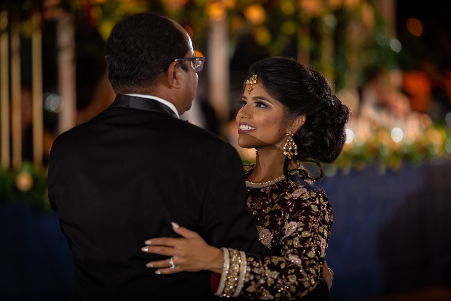 A bride dancing with her father during a wedding reception at the Tappan Hill Mansion.
