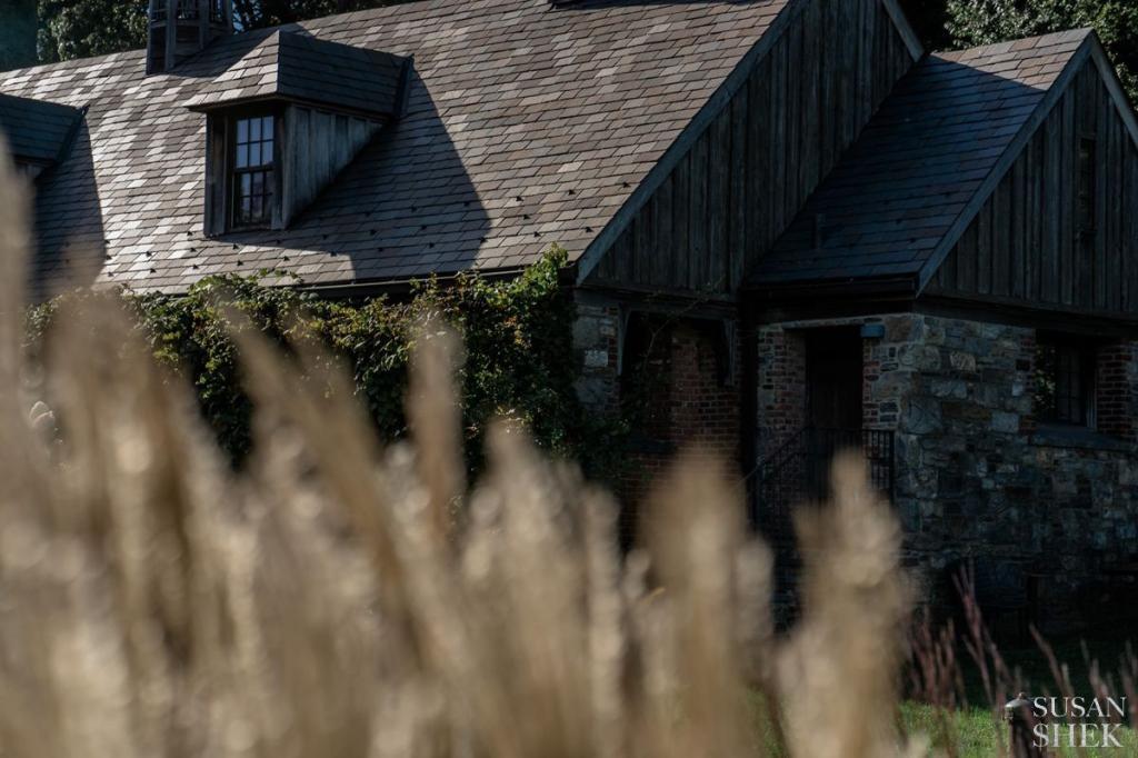 perspective through the grass at blue hill stone barns