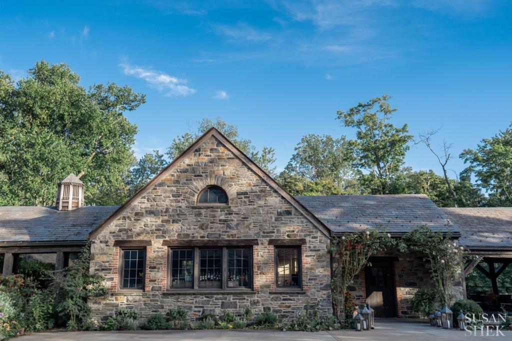 the outside facade of the restaurant entrance of blue hill stone barns