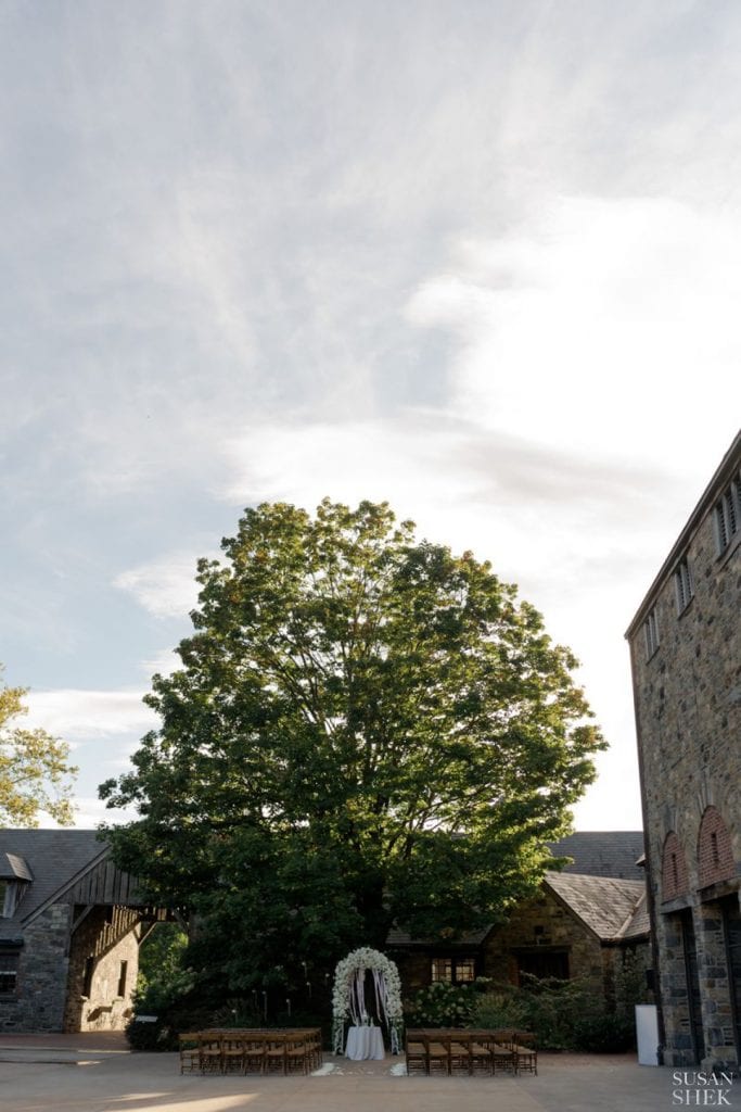 wide shot of the wedding ceremony at blue hill stone barns