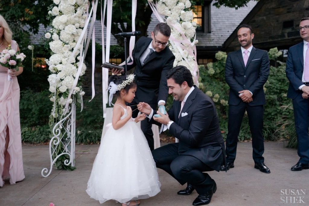 flower girl receiving gift at blue hill stone barns