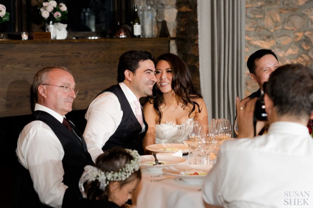 candid photo at the married couples table at blue hill stone barns