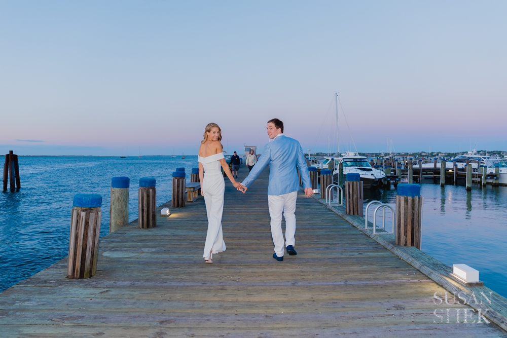 couple on the dock of cru nantucket