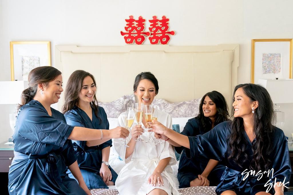 bride and bridesmaids cheering for their wedding at the rainbow room