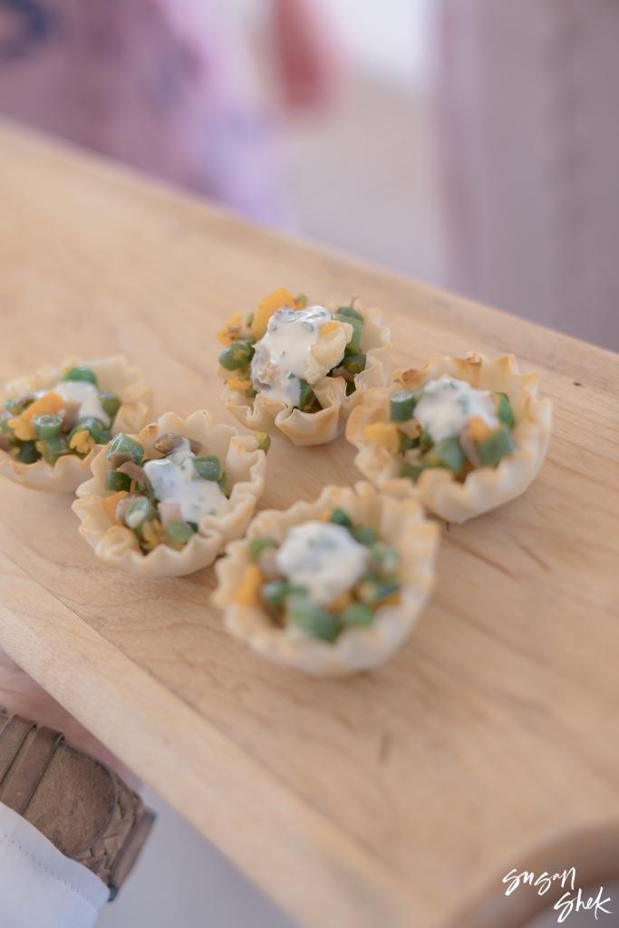 Phyllo cup appetizers on a wooden board