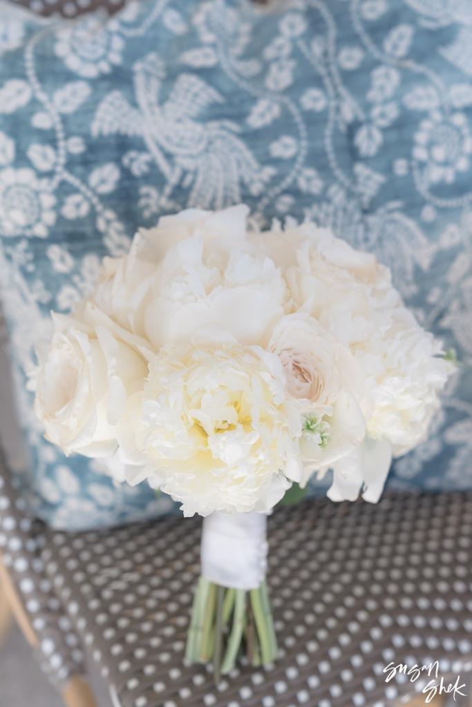 Bride's bouquet of white peonies and garden roses