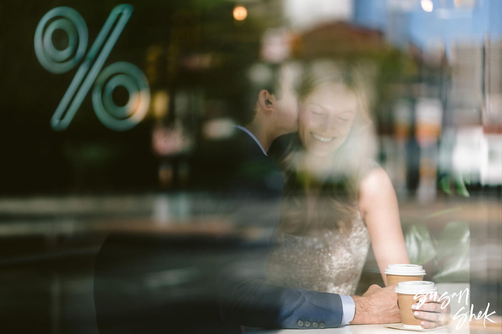 arabica coffee shop in dumbo engagement photos with a beautiful couple and a reflection in the window