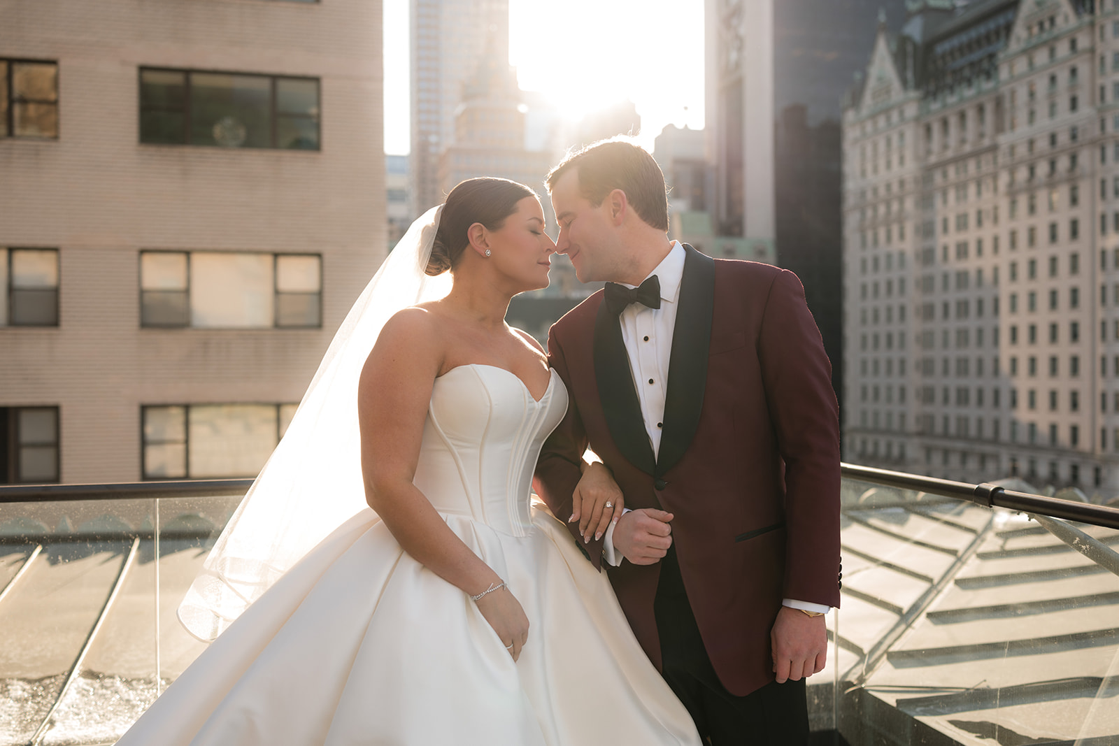 Couple embracing outside the Metropolitan Club in New York City during winter