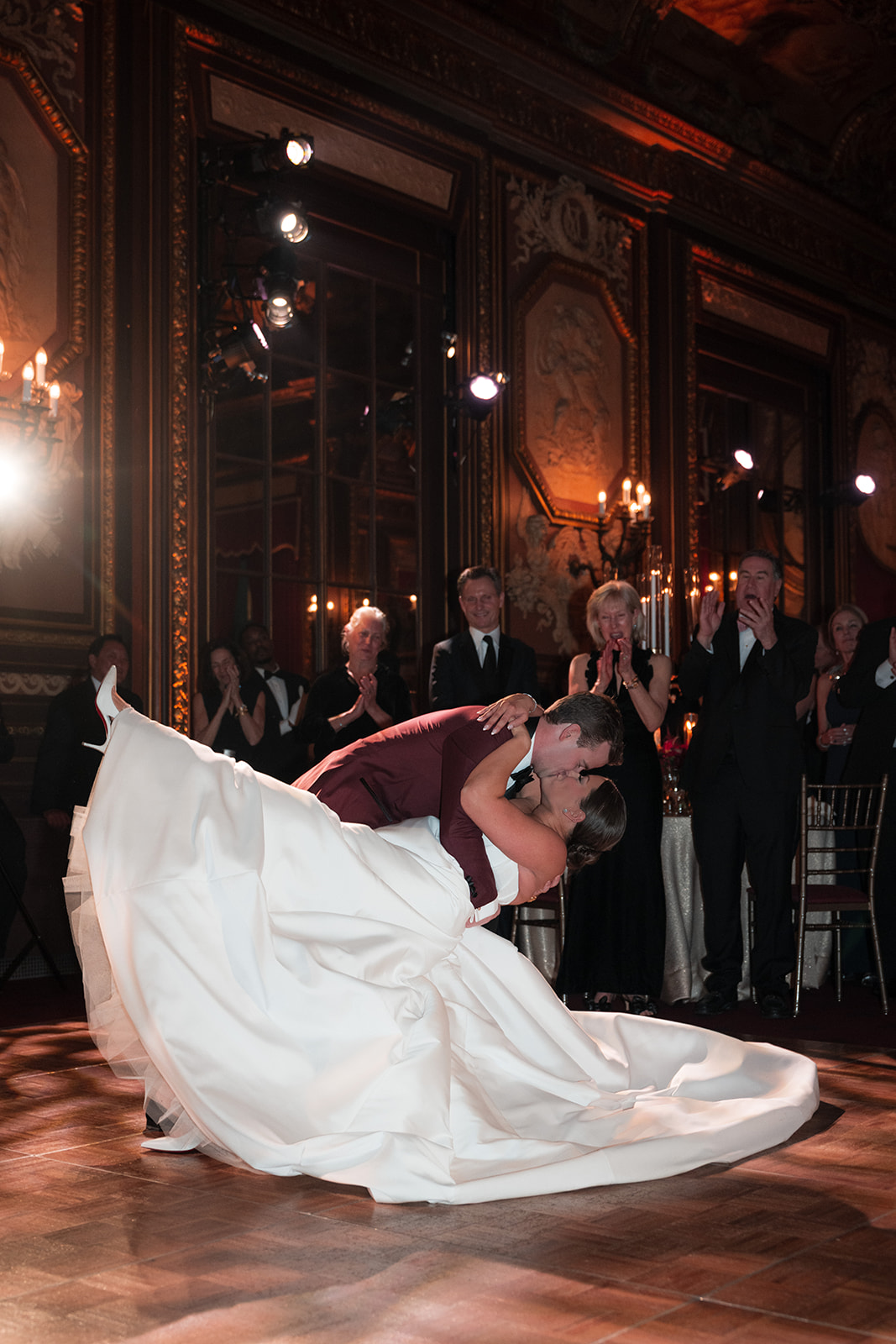 a first dance dip with the bride and groom at their wedding photograph by susan shek