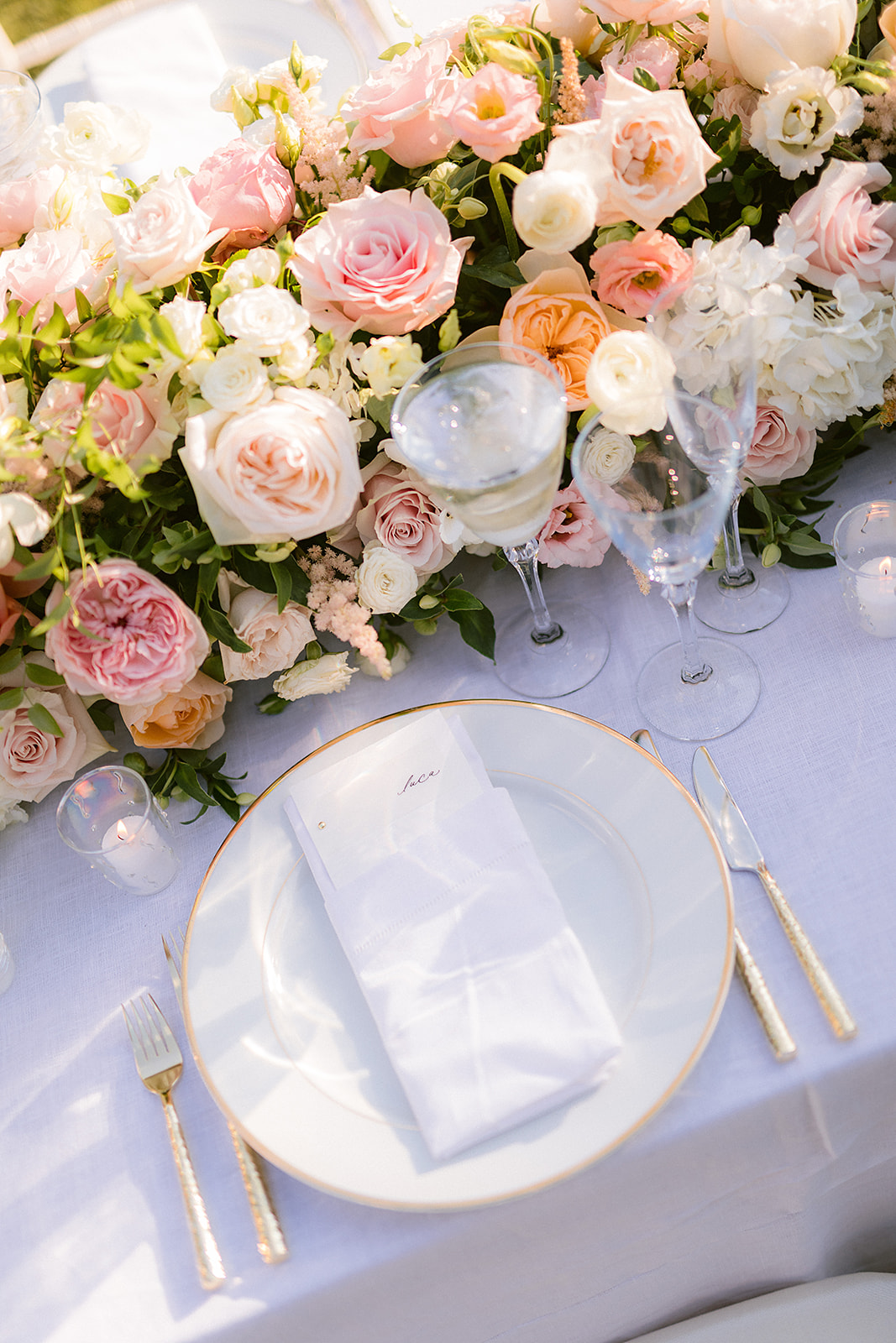 Close-up of pastel wedding tablescape at 620 Loft and Garden rooftop reception