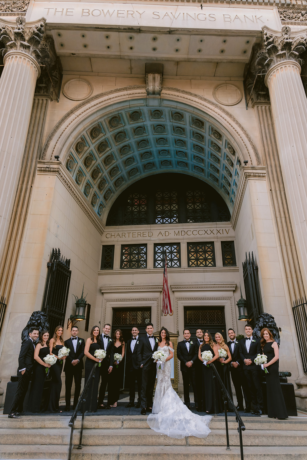 Wedding party portrait on the grand steps of The Bowery Savings Bank, home to Capitale in Manhattan.