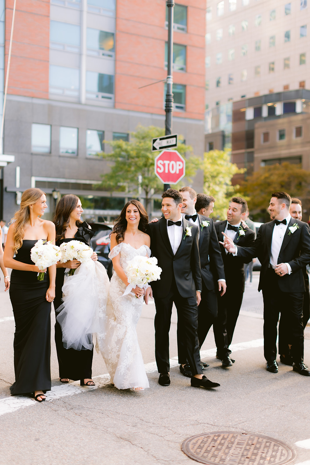 Bridal party walking through downtown Manhattan with the bride and groom on their wedding day