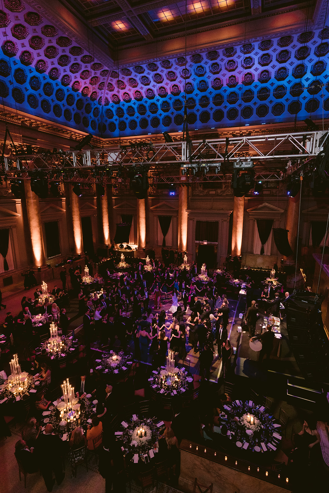 Wide-angle view of Capitale’s ornate ceiling and candlelit reception setup during a luxury New York City wedding