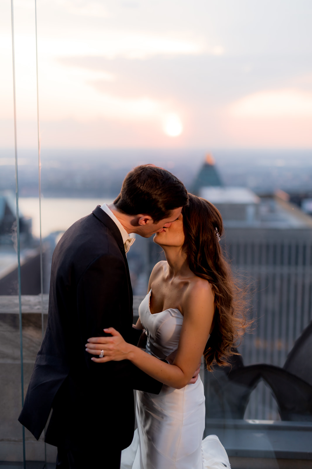 Romantic rooftop wedding moment  with views of NYC during sunset