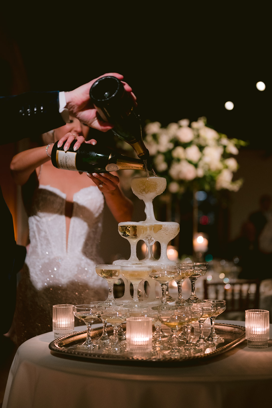 Champagne tower celebration during Liberty Warehouse wedding reception in Brooklyn