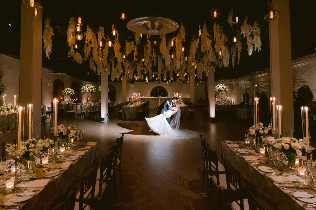 bride and groom sharing a kiss in their reception Liberty Warehouse